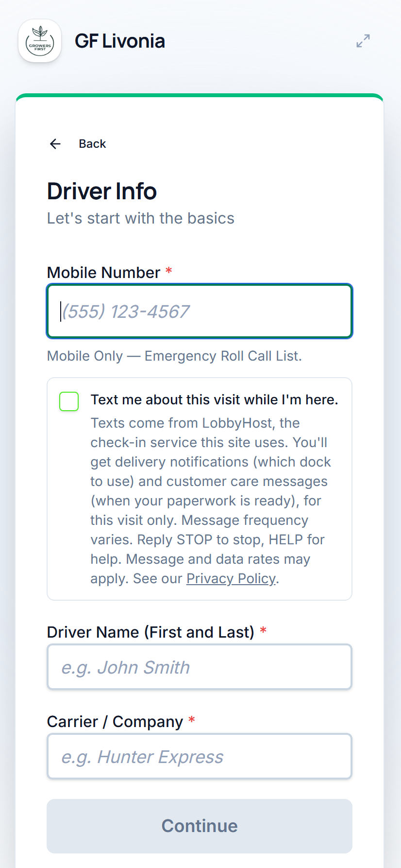 The driver check-in screen: a mobile number field, and below it an unticked box reading 'Text me about this visit while I'm here.'
